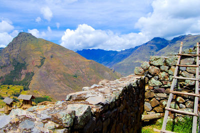 Scenic view of mountains against cloudy sky