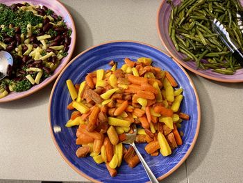 High angle view of chopped fruits in bowl on table