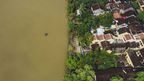 High angle view of trees and buildings against sky