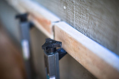 Close-up of hand on metal wall