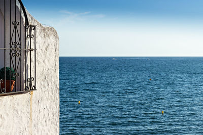 Scenic view of sea against blue sky