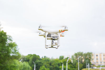 Low angle view of camera against sky