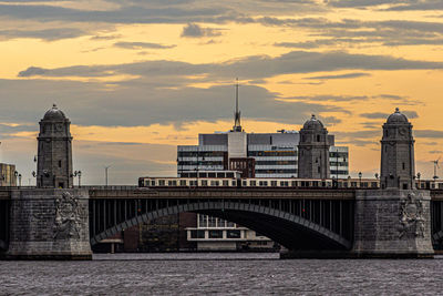 Train on bridge with boston sunset