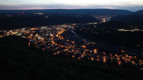 High angle view of illuminated buildings in city at night