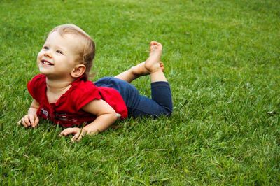 Girl relaxing on grassy field