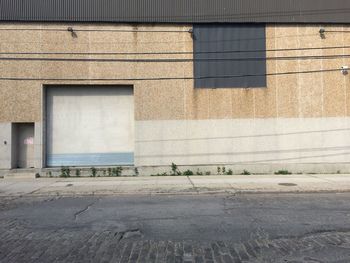 Brick wall with building in background