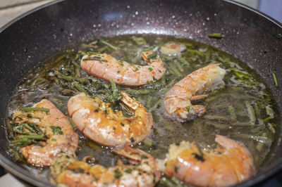 High angle view of meat in cooking pan