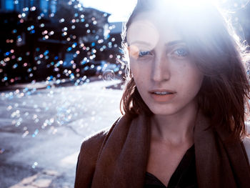 Portrait of young woman looking away