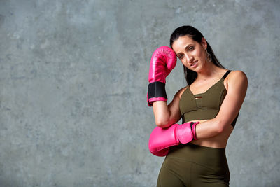 Young woman exercising in gym