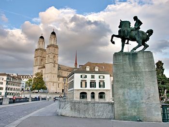 Statue of historic building against sky