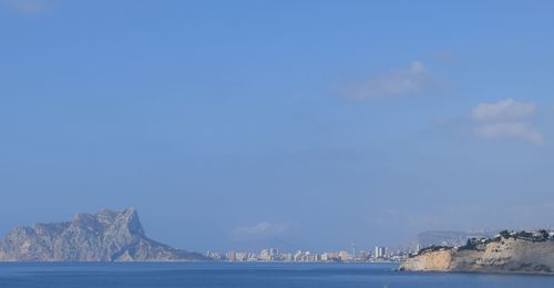 Scenic view of sea against blue sky