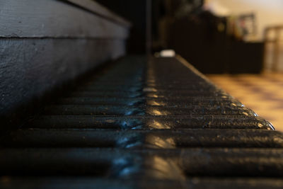 Close-up of old metal structure on table