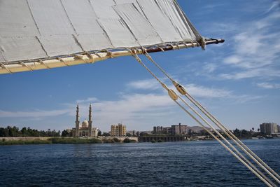 Mosque by river nile against sky