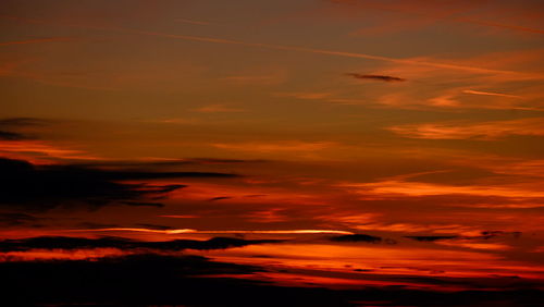 Scenic view of dramatic sky during sunset