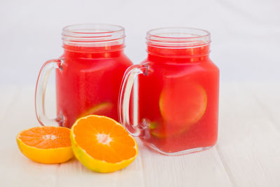 Close-up of orange juice in glass on table