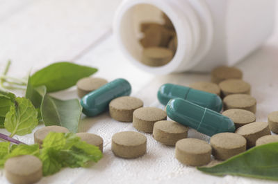 Close-up of herbal medicines on table