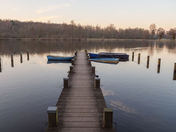 Pier over lake against sky