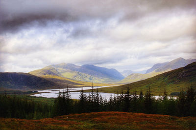 Scenic view of landscape and mountains against sky