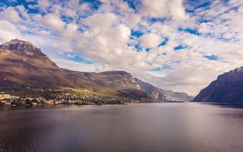 Scenic view of lake and mountains against sky