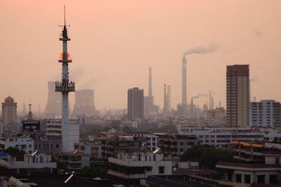 View of cityscape against sky during sunset