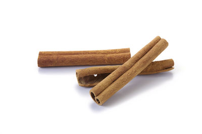 Close-up of coffee beans against white background