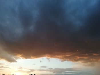 Low angle view of dramatic sky during sunset