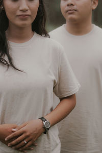 Midsection of woman standing at home