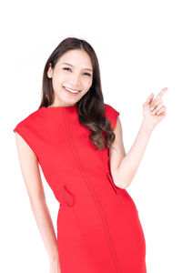 Portrait of a smiling young woman against white background