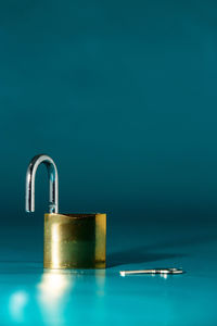 Close-up of blue glass on table