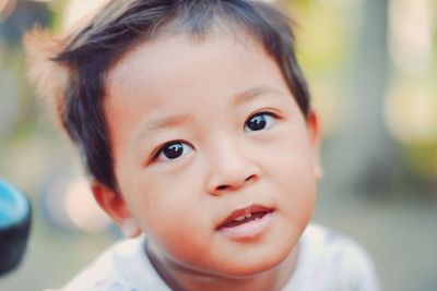 Close-up of cute girl looking away