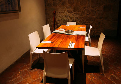 High angle view of empty chairs and table at home