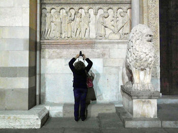 Man statue against building