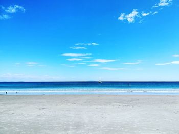 View of beach against blue sky