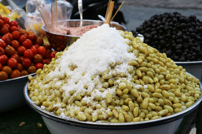 Close-up of fruits in container for sale in market