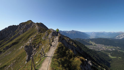 Panoramic view of mountains against clear blue sky