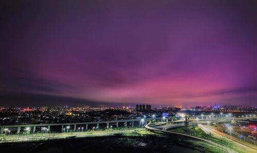 High angle view of elevated road in city against cloudy sky