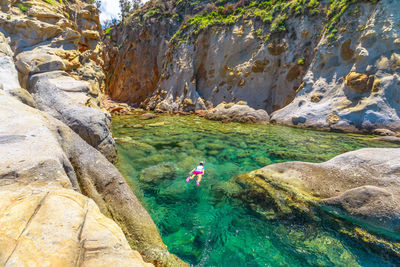 Scenic view of rocks by sea