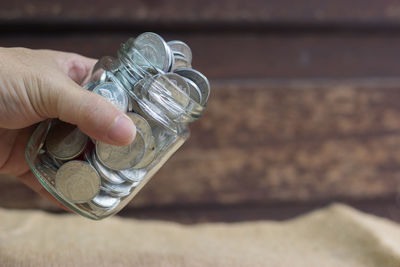 Midsection of person holding glass