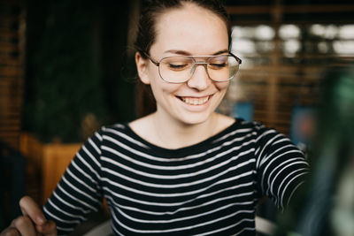 Portrait of smiling young woman