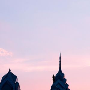 Low angle view of building against sky during sunset