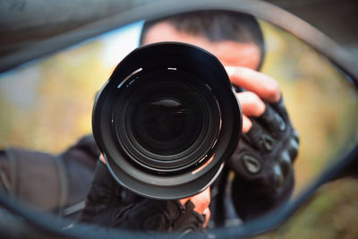 Close-up of hand holding camera