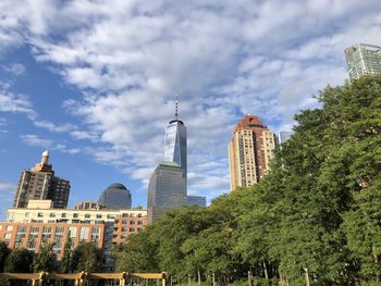 Panoramic view of buildings and trees against sky