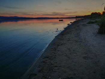 Scenic view of sea against sky at sunset