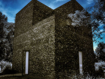 Low angle view of old building against sky