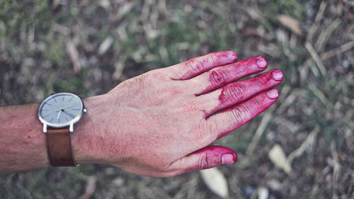 Close-up of human hand against blurred background