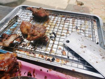 High angle view of meat on barbecue grill