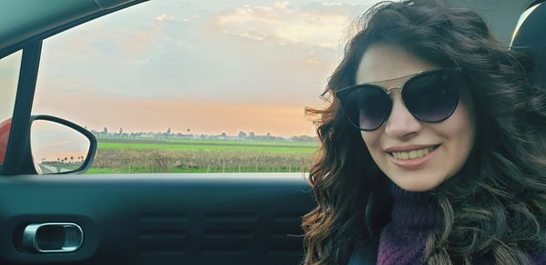 Portrait of beautiful woman in car