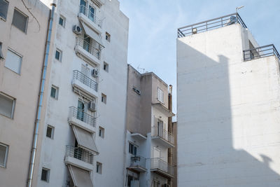 Athens, greece - february 12, 2020. beautiful streets of athens with blocks of flats, cars and shops