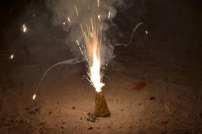 Close-up of burning fire crackers at night