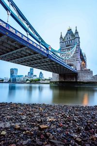 Low angle view of tower bridge over thames river against clear sky